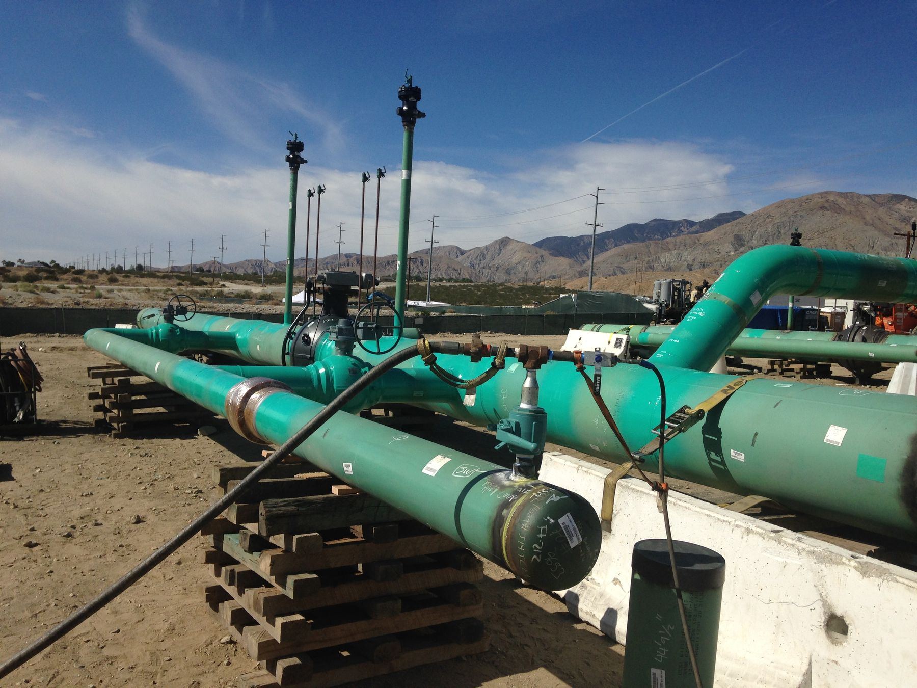 Coated pipe assembly set up for hydrostatic testing on a job site